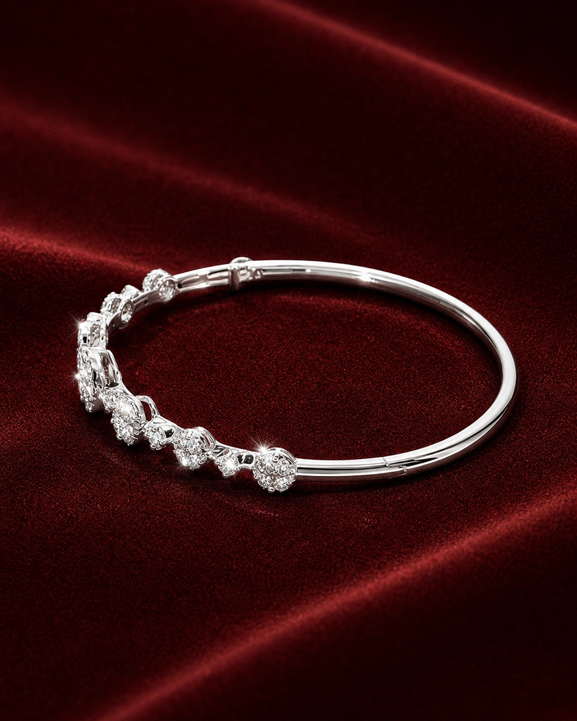 Campaign image featuring EBG2580 diamond bangle arc on ERS4997 burgundy velvet scene