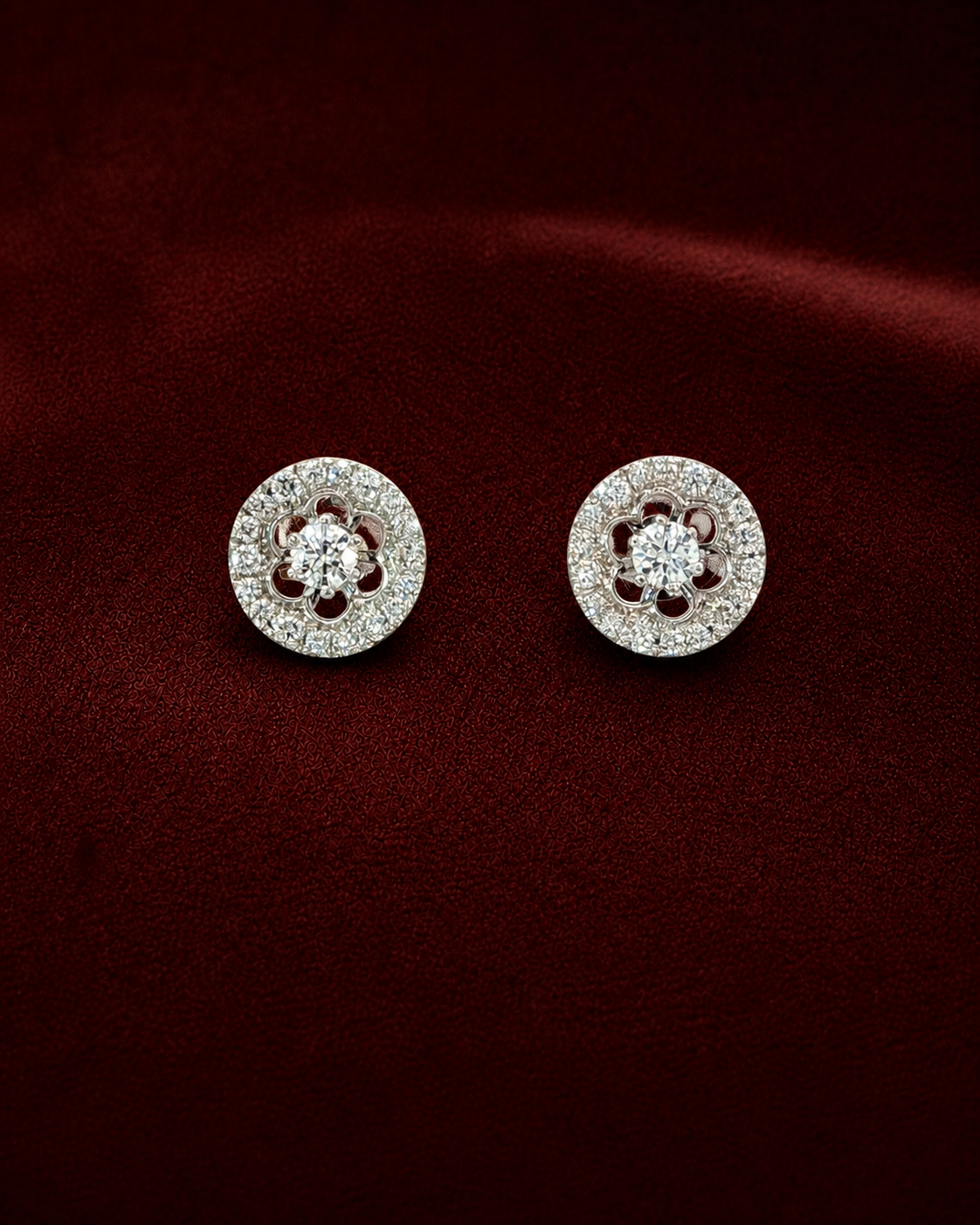 EES2173 floral halo diamond stud earrings on deep burgundy velvet