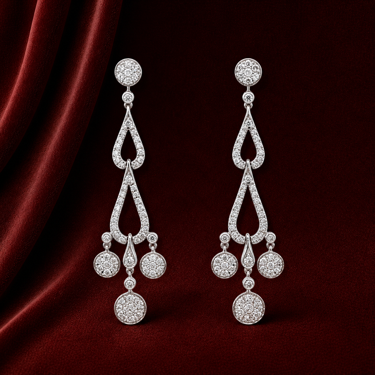 EES3743 double teardrop cascade diamond earrings on deep burgundy velvet