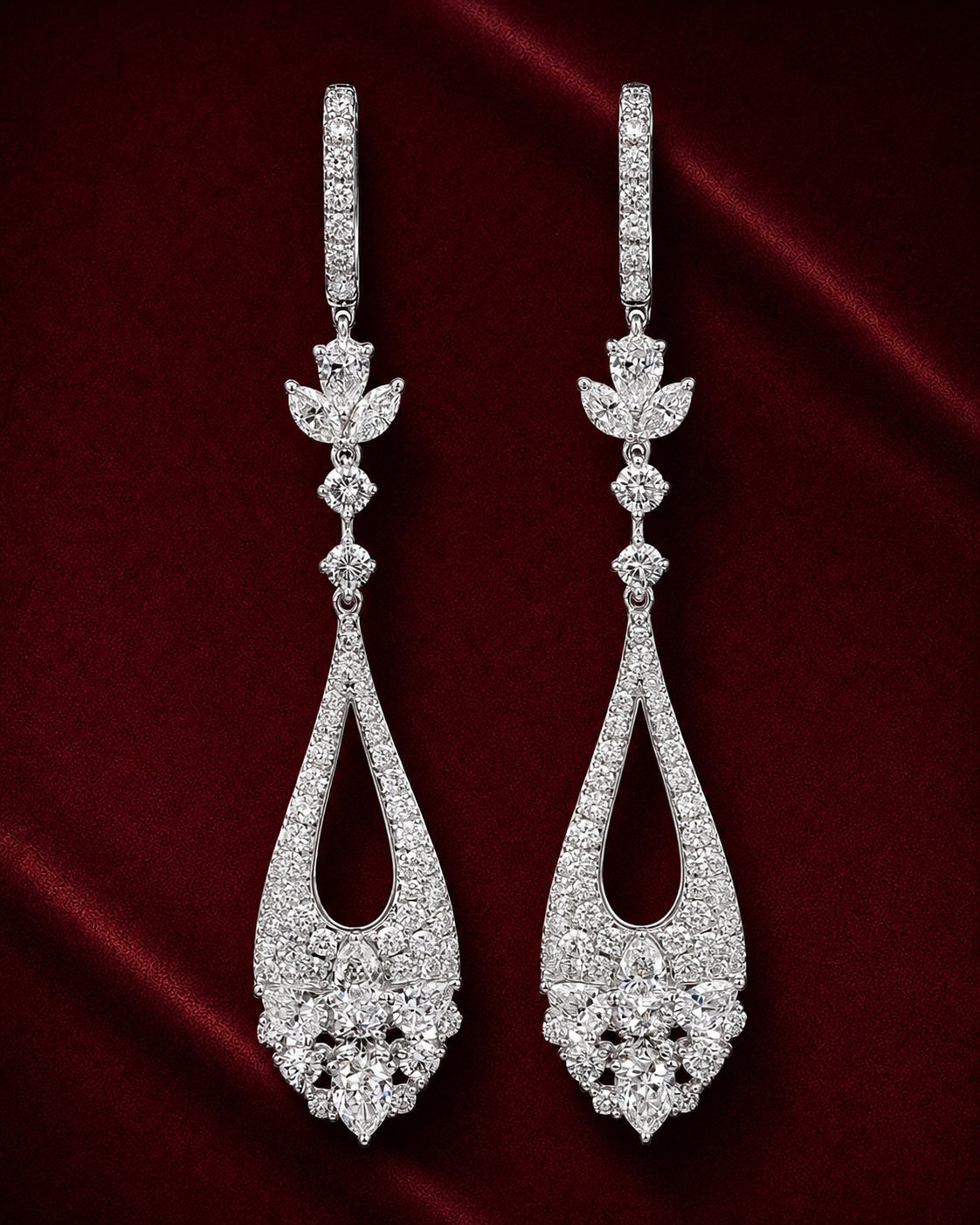 EES4005 floral teardrop diamond earrings on a deep red velvet background
