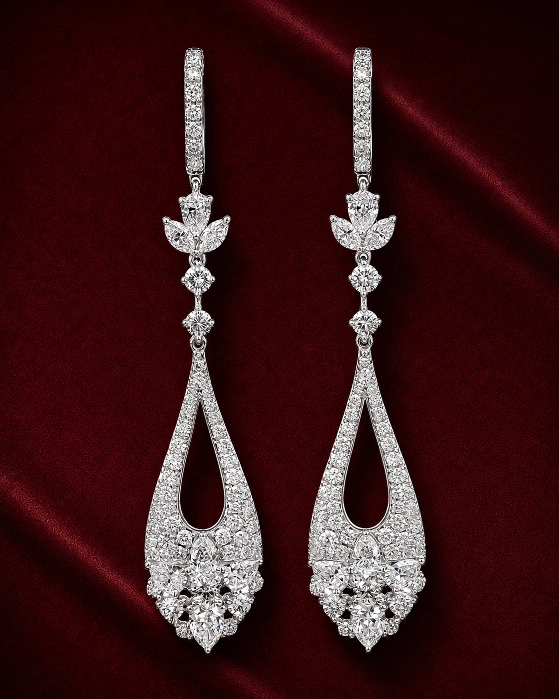 EES4005 floral teardrop diamond earrings on a deep red velvet background