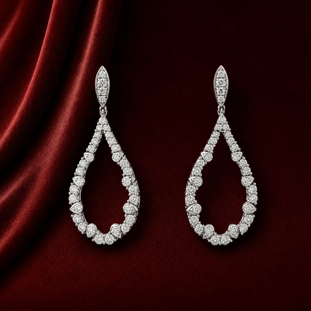 EES4007 marquise teardrop pavé earrings on deep burgundy velvet