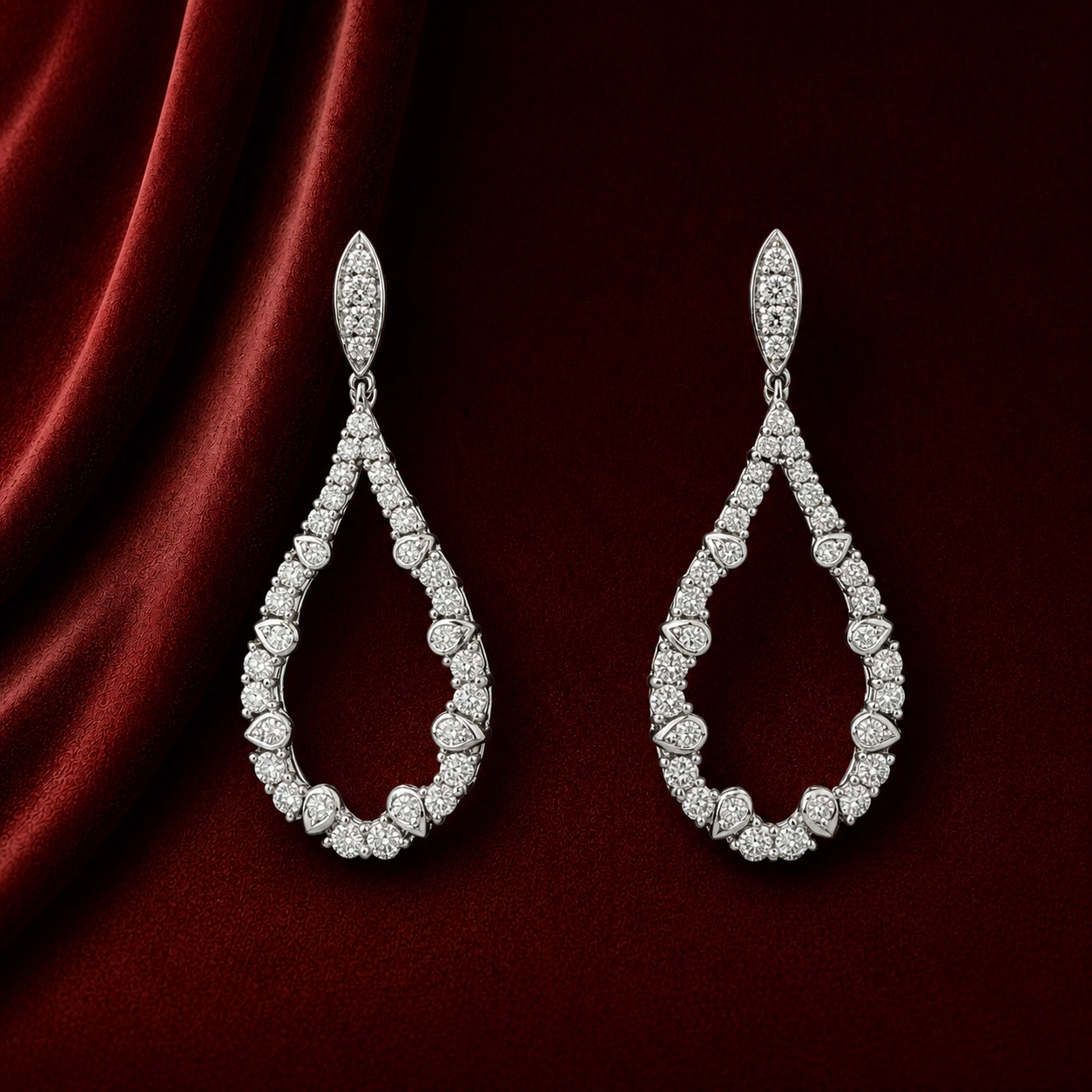EES4007 marquise teardrop pavé earrings on deep burgundy velvet