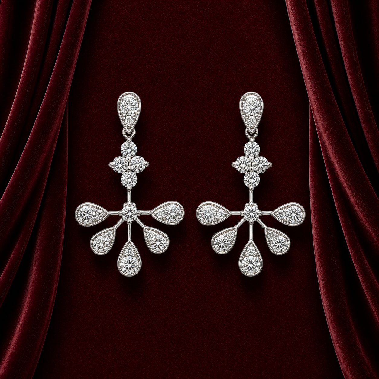 EES4147 floral pear drop diamond earrings on deep burgundy velvet