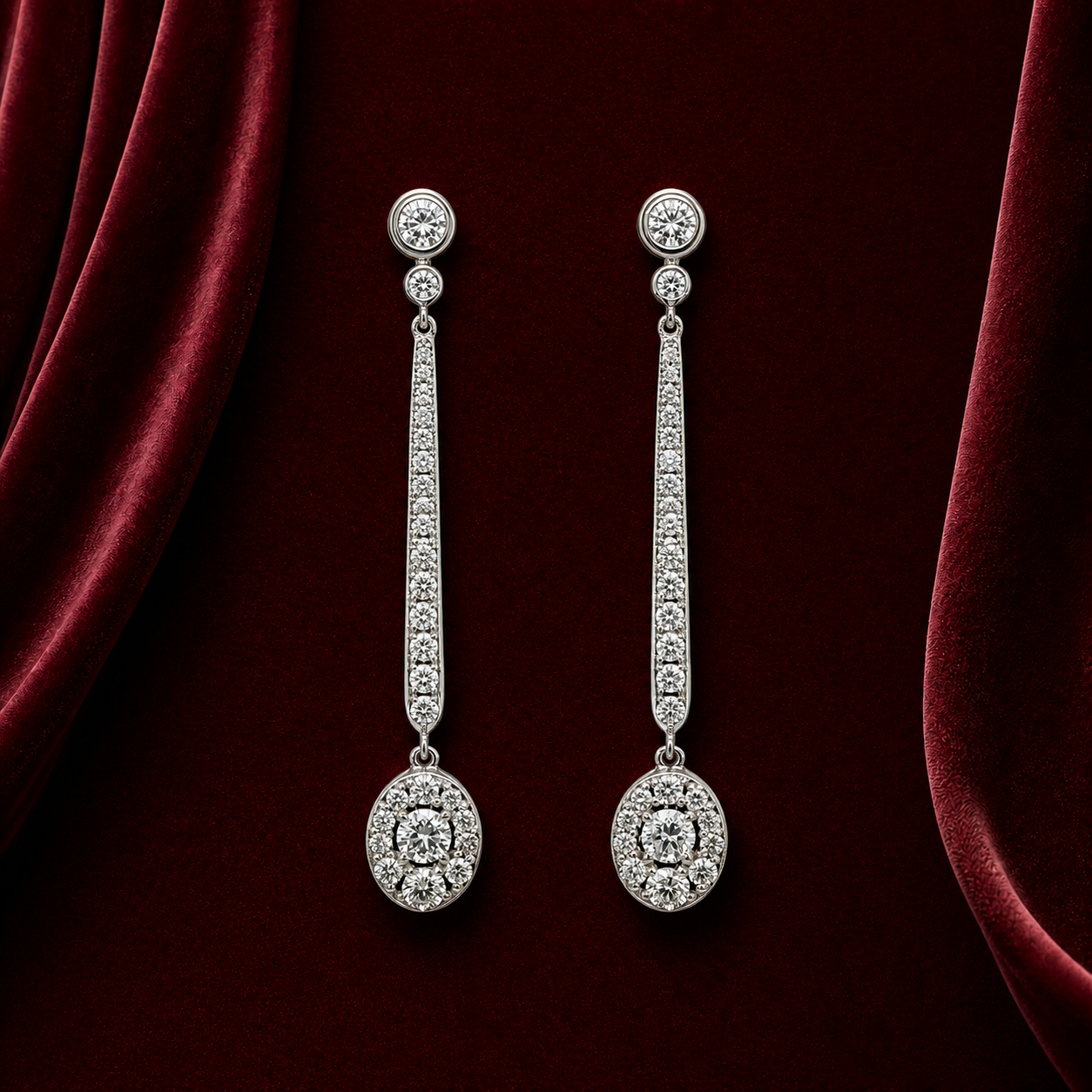 EES5752 tapered bar and oval diamond drop earrings on deep burgundy velvet