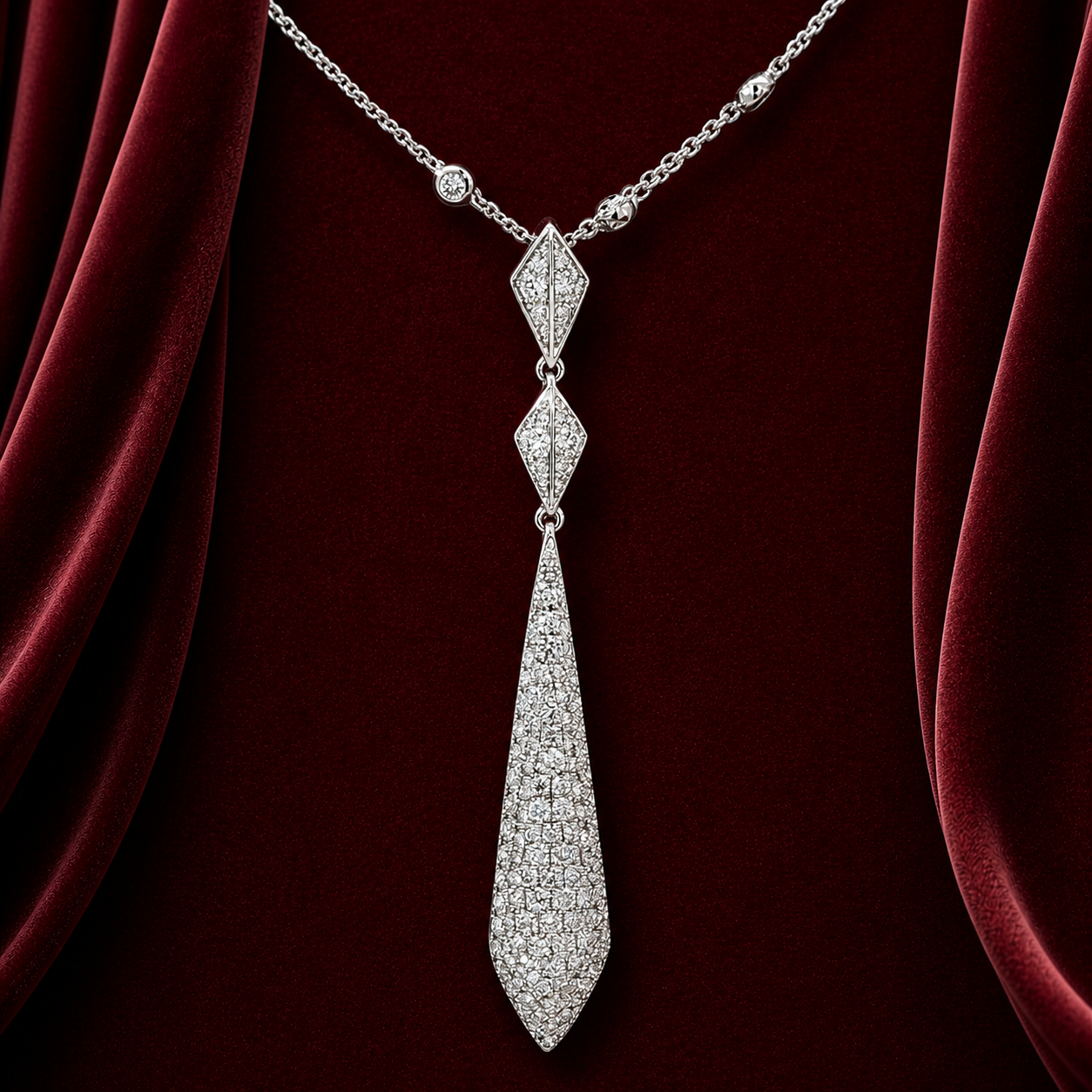 ENK2361 geometric kite drop necklace on deep burgundy velvet