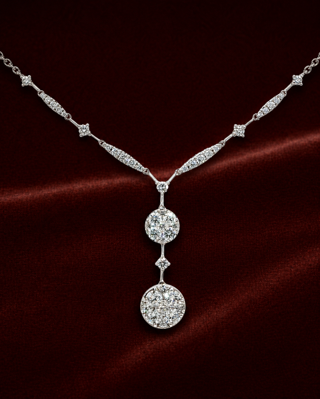 ENS2212 double circle drop diamond necklace on a deep red velvet background