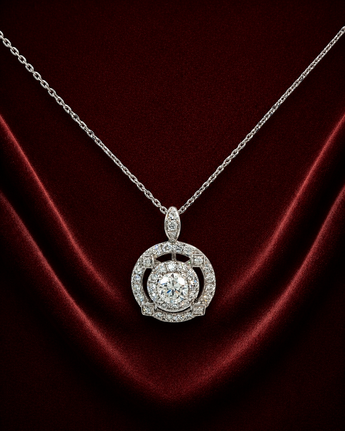 ENS3258 openwork orbit pendant necklace on deep burgundy velvet