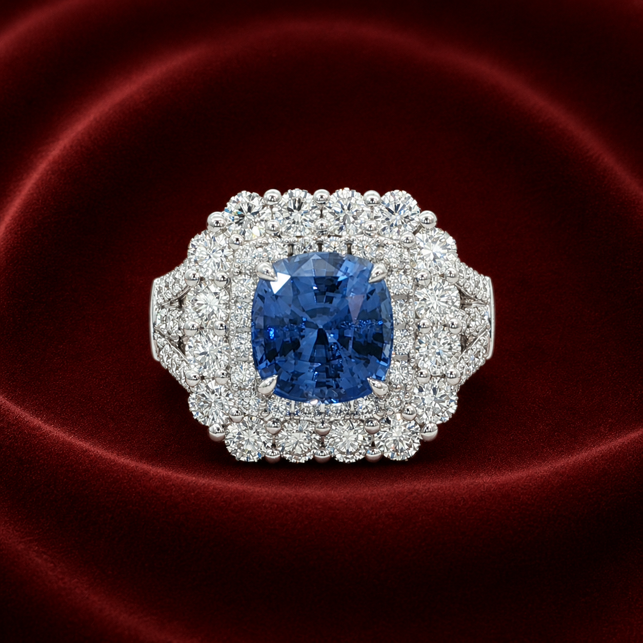 ERS3431 blue sapphire floral halo ring on deep burgundy velvet