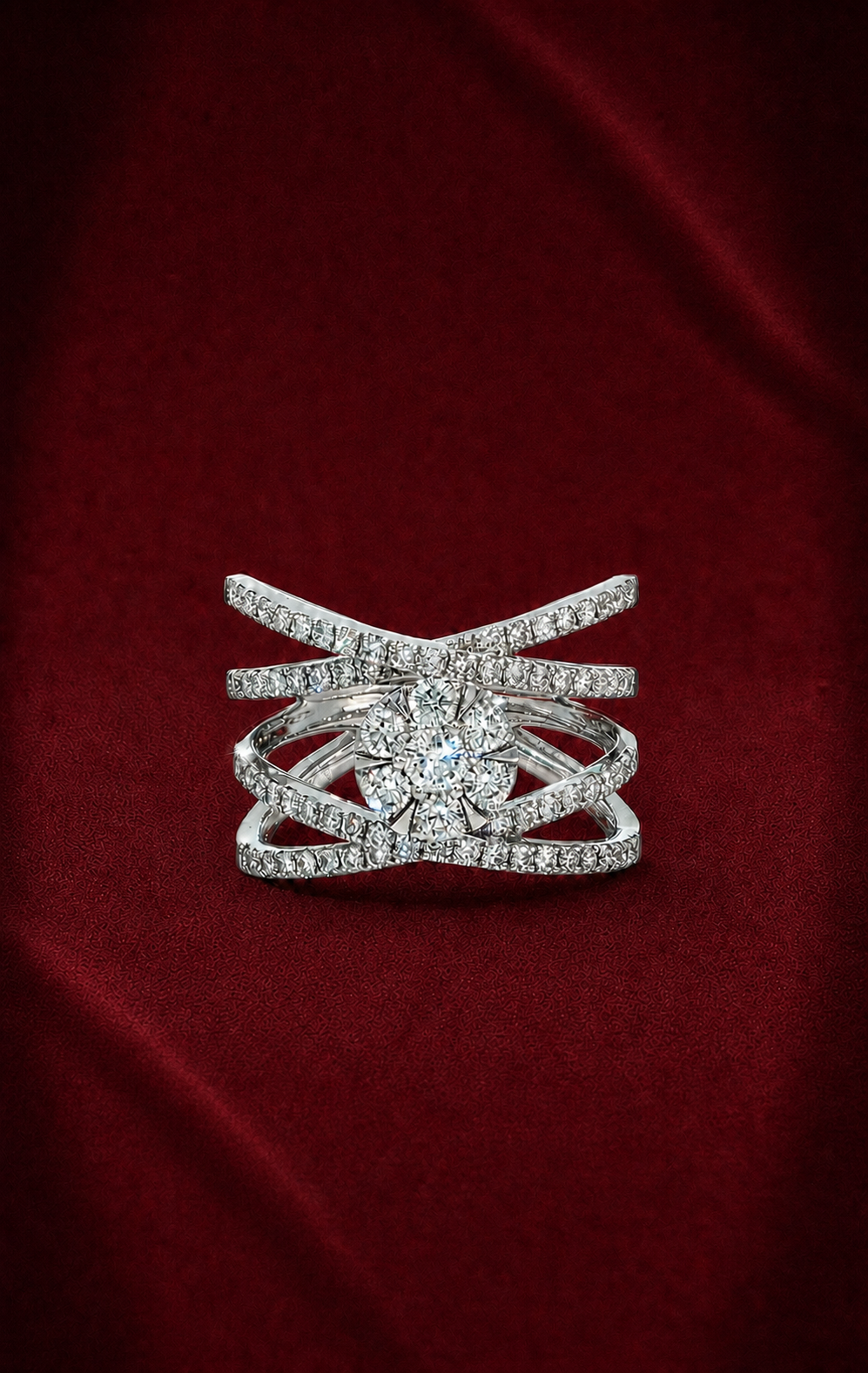 Front-facing ERS4997 cross lattice diamond ring on softly creased deep burgundy velvet