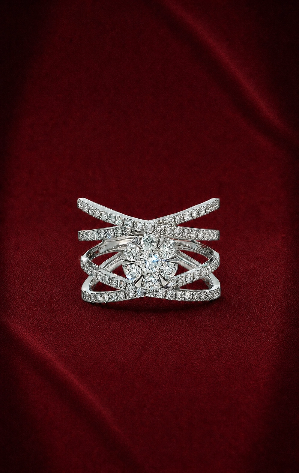 Front-facing ERS4997 cross lattice diamond ring on softly creased deep burgundy velvet