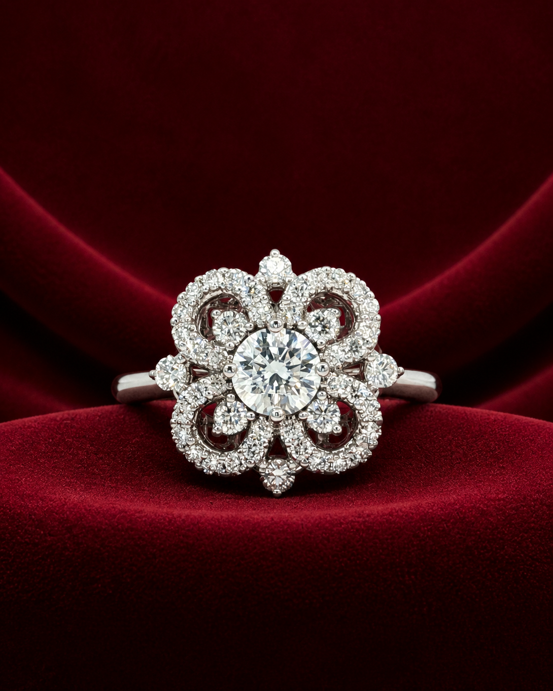 ERS6444 floral halo solitaire ring on deep burgundy velvet