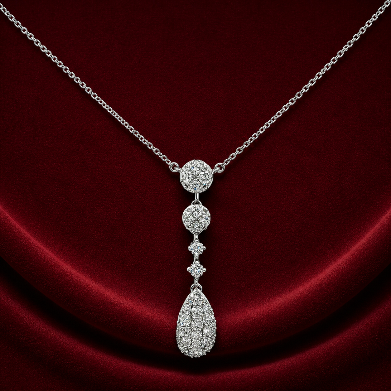 FNS1580 cascade teardrop pendant necklace on deep burgundy velvet