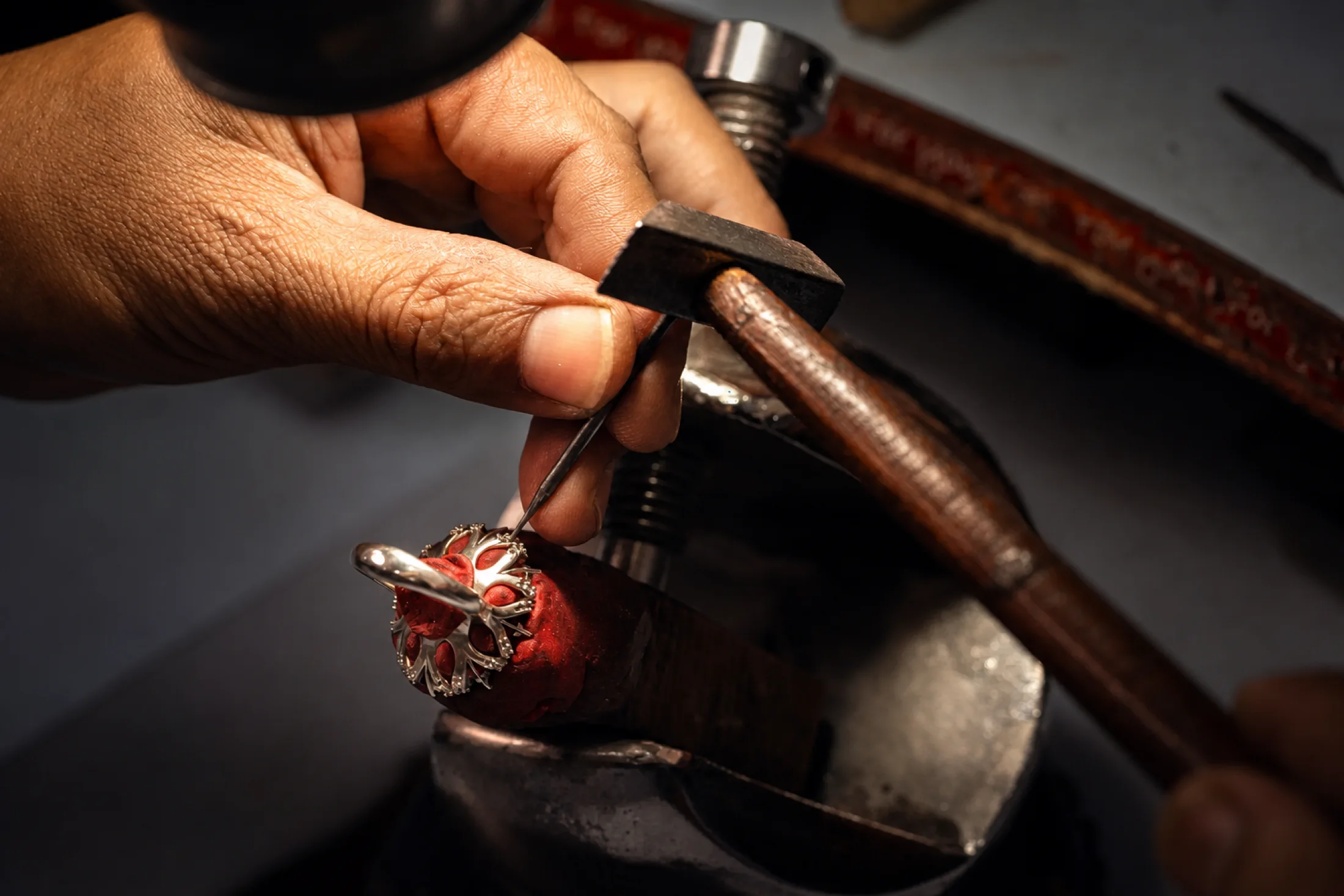 Hand fabrication and refinement of a jewelry piece at the workbench